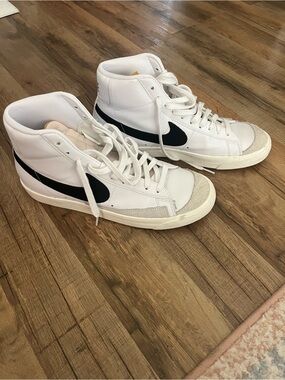 Nike White High-Top Sneakers with Black Swoosh